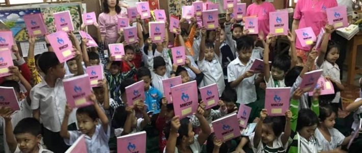 Donation of books and fed chicken rice porridge for students